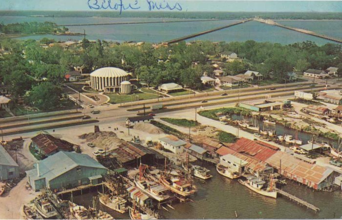 The picturesque eastern top of the Biloxi peninsula lies between Back Bay Biloxi and the Gulf of Mexico. Shrimp and oyster boats dock before beautiful St. Michael's Church which echoes the sea in its shell-like dome and the fish-and-nets motif of its stained glass windows. Biloxi, Miss.