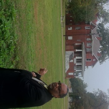 Mayor Darrell Johnson of Mound Bayou points the way to the Isaiah T. Montgomery House.