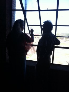 Erica Speed and Bruce Smith admire a restored window at the J.J. Rogers Building