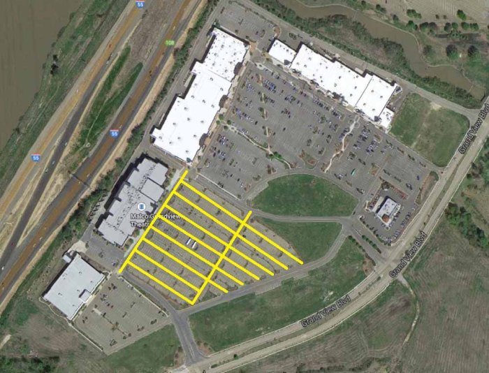 Half of the original Madisonia fortified city survives in the L-shaped section with white roofs. The corner towers are an obvious sign that the Greco-Romans came under attack at some point in their history, leading them to renew the idea of a walled city with guard towers. The Malco Theater section was a later addition to the city grid, and its parking lot lanes are a clever disguise of the original Roman centuriation grid system.