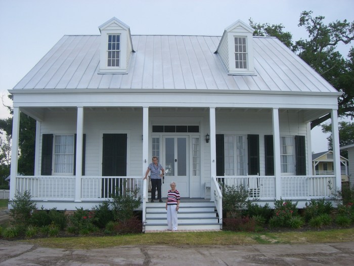 Dot Phillips and Juanita Gex on the porch of Phillips’ newly restored house in Bay St Louis. Katrina pushed the house off its foundation leaving it like crumpled paper. The restoration revealed the house to be decades older than previously thought and several modifications were removed returning the house to its original appearance.