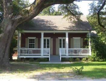 The office of Wagner's architectural firm in Bay St. Louis was housed for many years in this carefully restored nineteenth century creole cottage at 342 Main Street. Galleries undercutting a gabled roof are a classic staple of Louisiana style as are the shuttered double French doors.