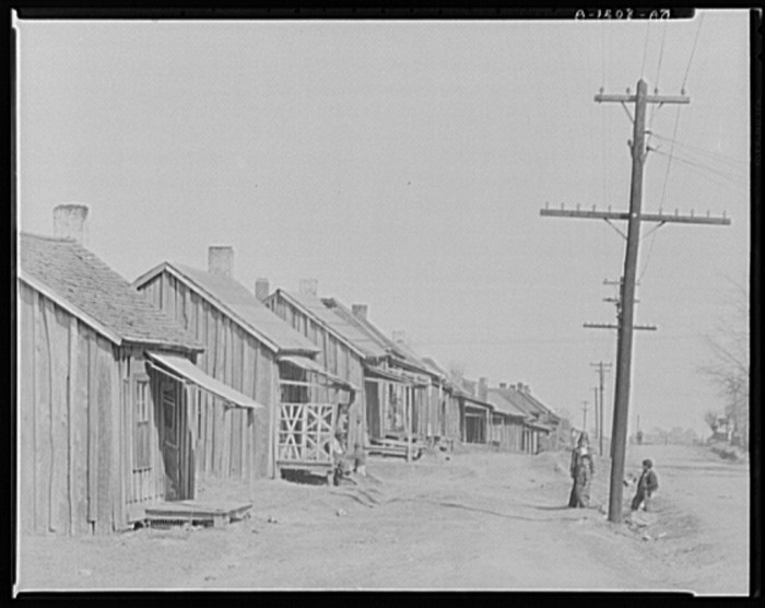 Street in Negro quarter. Tupelo, Mississippi. Walker Evans (1903-1975), photographer. Date Created: 1936 Mar. Medium: 1 negative : nitrate ; 8 x 10 inches or smaller.