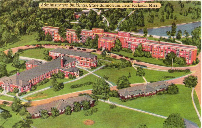 ADMINISTRATION BUILDINGS, STATE SANATORIUM near JACKSON, MISSISSIPPI. The State Sanitorium is located high on a ridge in the dry clean air of the pine lands. The modern, fireproof buildings are in appearance rather like Southern Colonial homes, and includes a library, moving picture theatre, auditorium, and the Sanitorium publishes its own newspaper.